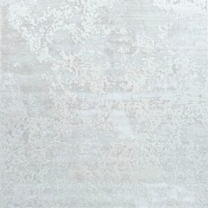 Pale gray abstract textured rug with mottled pattern