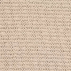 Close-up of beige looped carpet texture