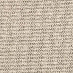 Close-up of light beige looped carpet texture