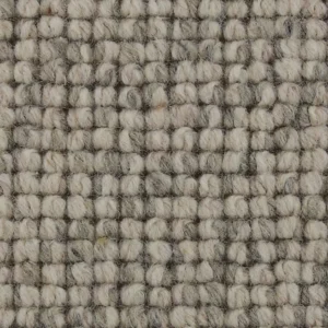 Close-up of textured gray and cream woven carpet fibers