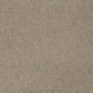 Close-up of beige loop-pile carpet texture